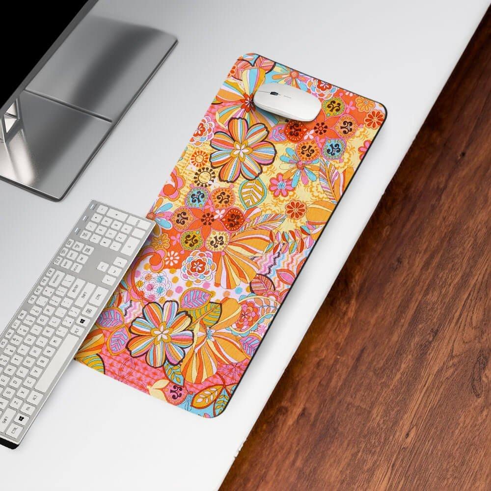 Colorful floral desk mat with keyboard and mouse on modern office desk