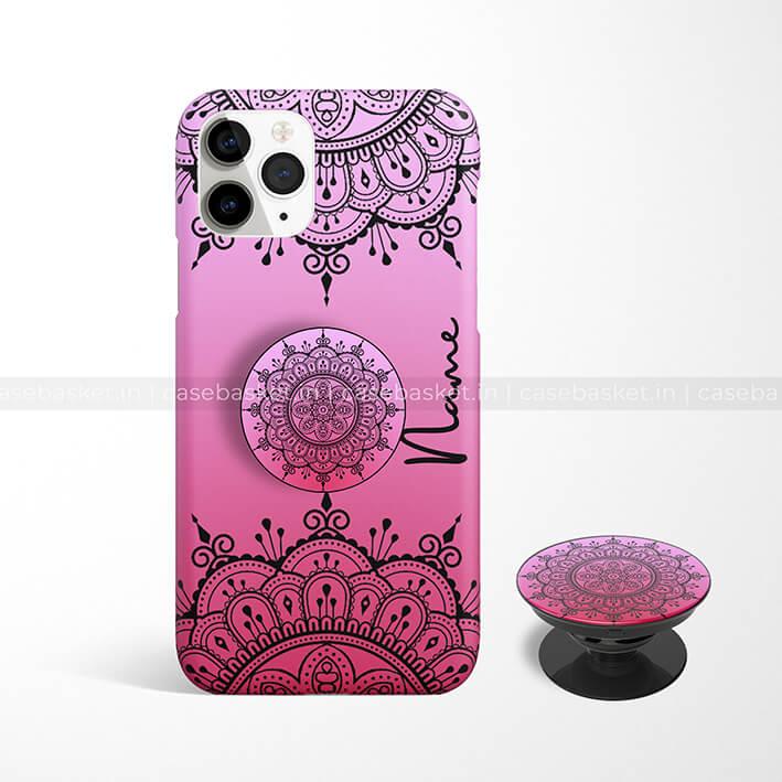 Pink phone case with black mandala design, matching pop socket, customizable text