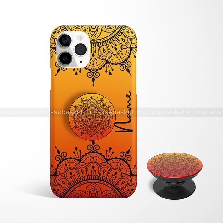 Orange and yellow mandala phone case with matching pop socket, intricate black design