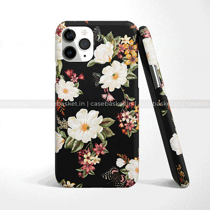 Black floral phone case with white and pink flower design, shown on smartphone