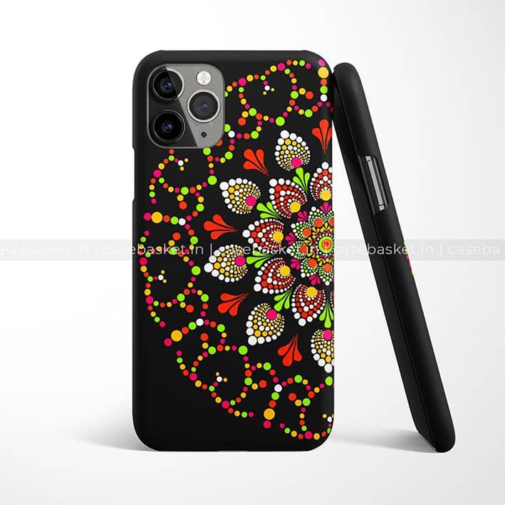 Black phone case with colorful dot mandala design in red, green, yellow, and white