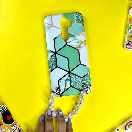 Mint green geometric phone case with gold accents and pearl chain handle on yellow background.