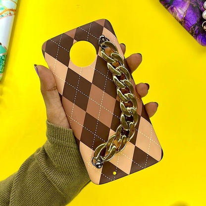 Brown checkered phone case with gold chain handle, held in hand on yellow background