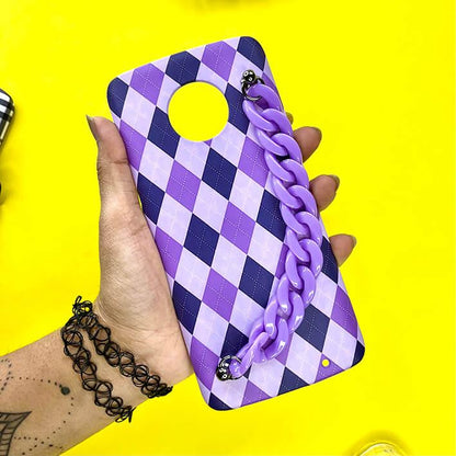 Purple argyle phone case with matching chain handle held in hand on yellow background