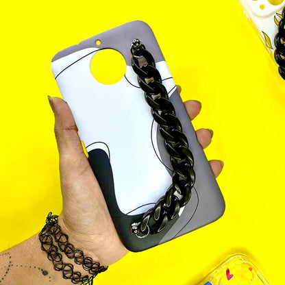 Hand holding a phone case with black chain handle and modern abstract design on yellow background.