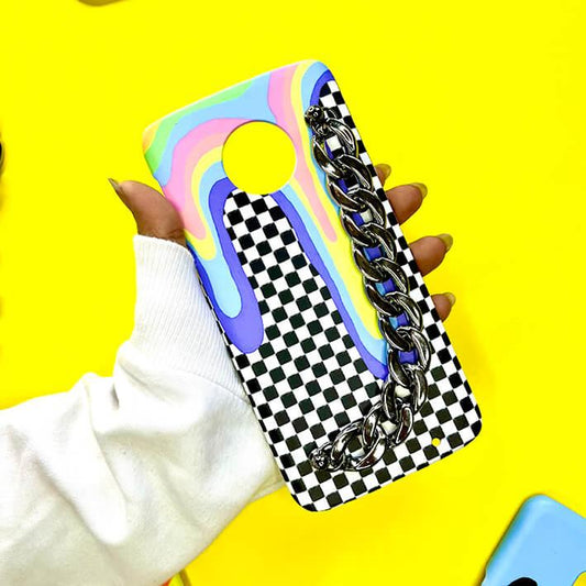 Checkered phone case with pastel drip design and silver chain, held against yellow background