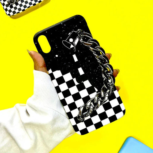 Black and white checkered phone case with chain handle and galaxy design, held in hand