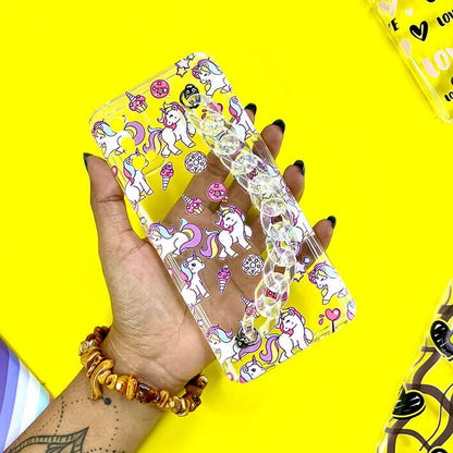 Clear unicorn phone case with beaded chain and colorful cartoon designs held in hand