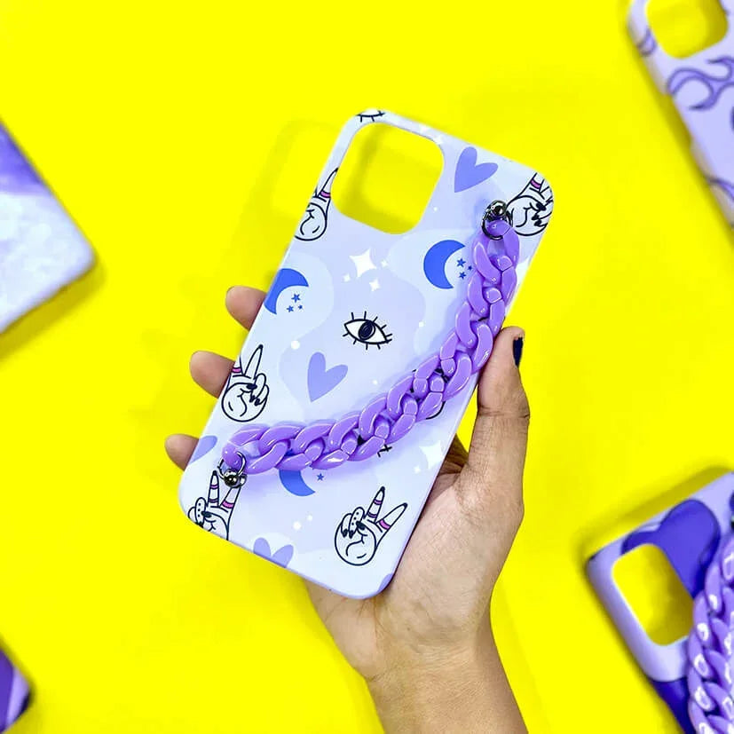 Purple chain phone case with cartoon hand, eye, moon and heart patterns held on yellow background