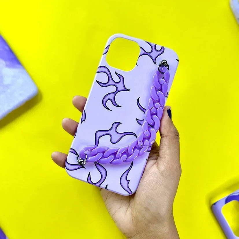 Purple chain phone case with black flame pattern held in hand on yellow background