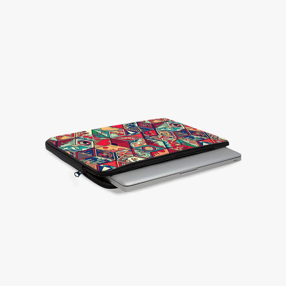 13-inch laptop sleeve with colorful geometric pattern, partially open with laptop inside