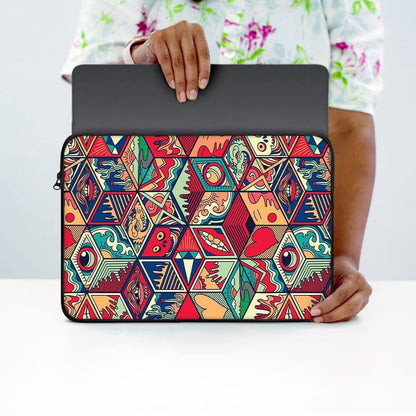 Person holding 13-inch laptop sleeve with colorful geometric and abstract pattern