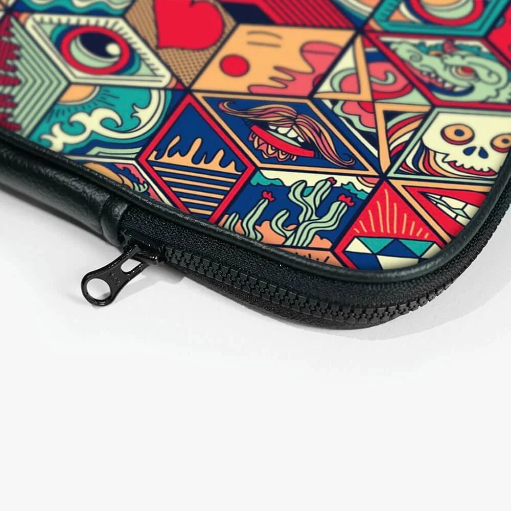 Close-up of a colorful graphic laptop sleeve with zipper and geometric patterns