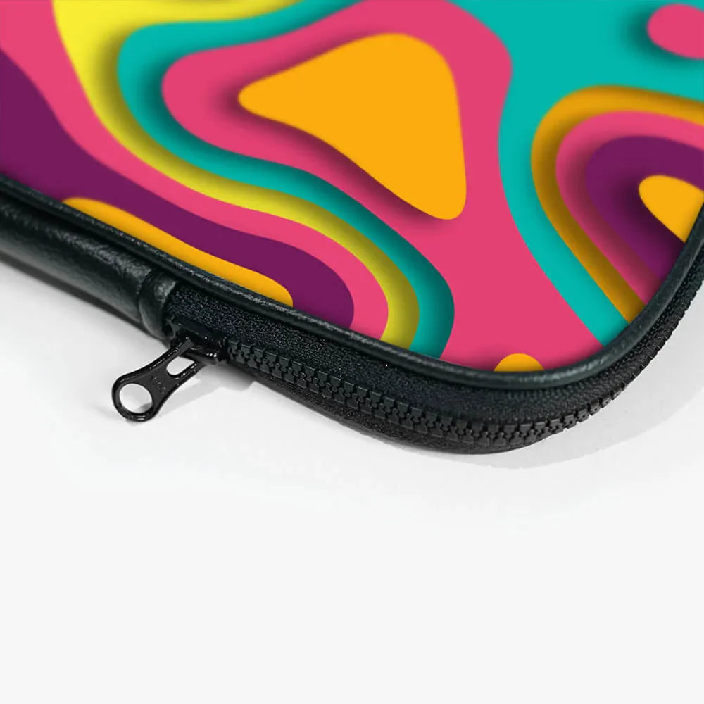 Colorful abstract laptop sleeve with zipper, pink, yellow, teal layered pattern