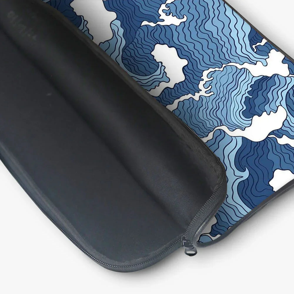 Blue abstract waves pattern laptop sleeve with zipper, open to show black interior