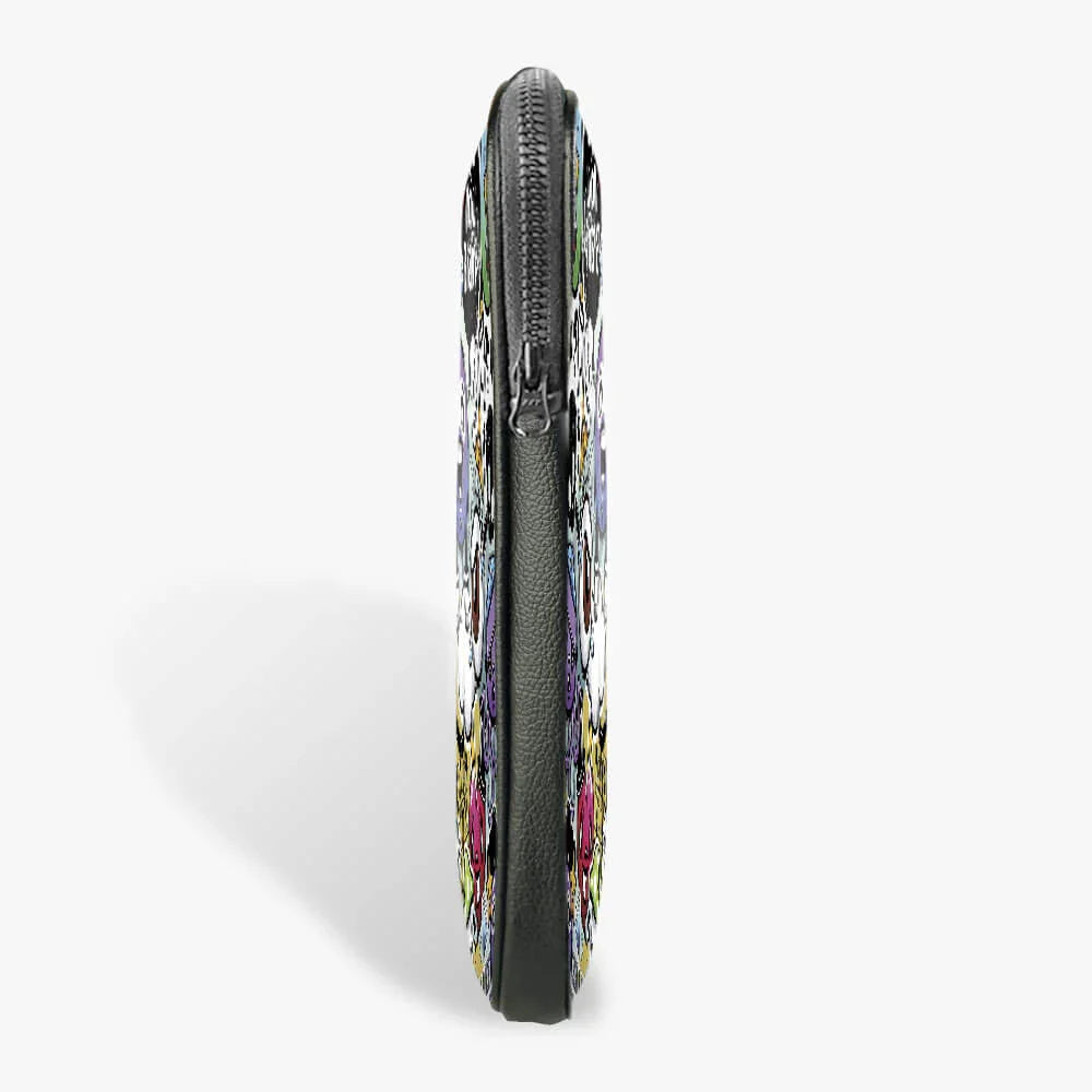 Side view of a 13-inch black laptop sleeve with colorful skull pattern and zipper closure