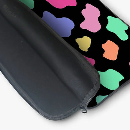 Black laptop sleeve with colorful abstract pattern and zipper closure, open view