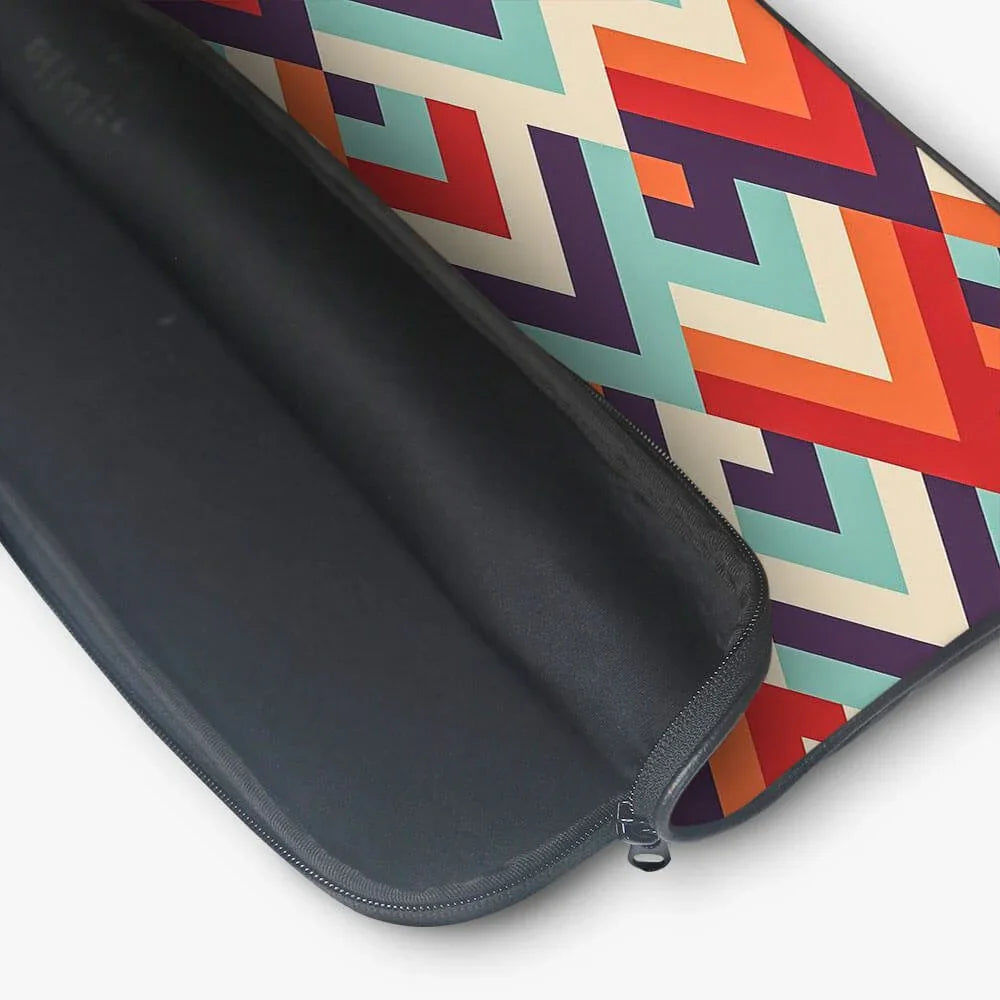 Colorful geometric patterned laptop sleeve with black interior and zipper closure