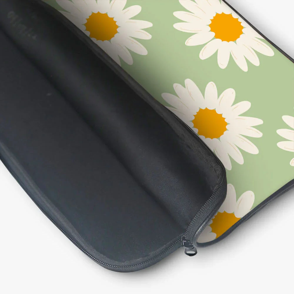 Open laptop sleeve with white daisy pattern on light green background, zippered case
