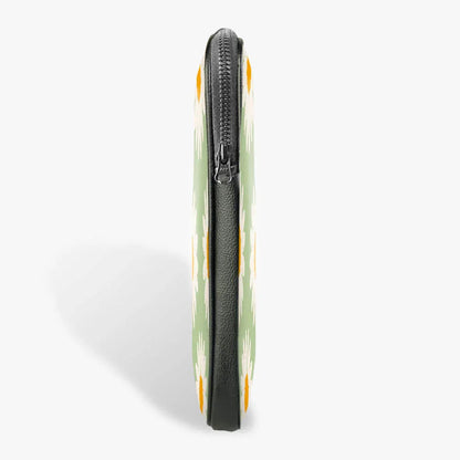 Side view of slim floral laptop sleeve with zipper and green daisy pattern