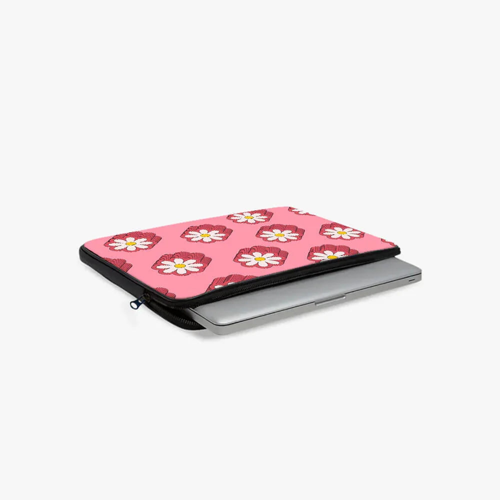 Pink floral laptop sleeve with zipper, partially opened, holding a silver laptop.