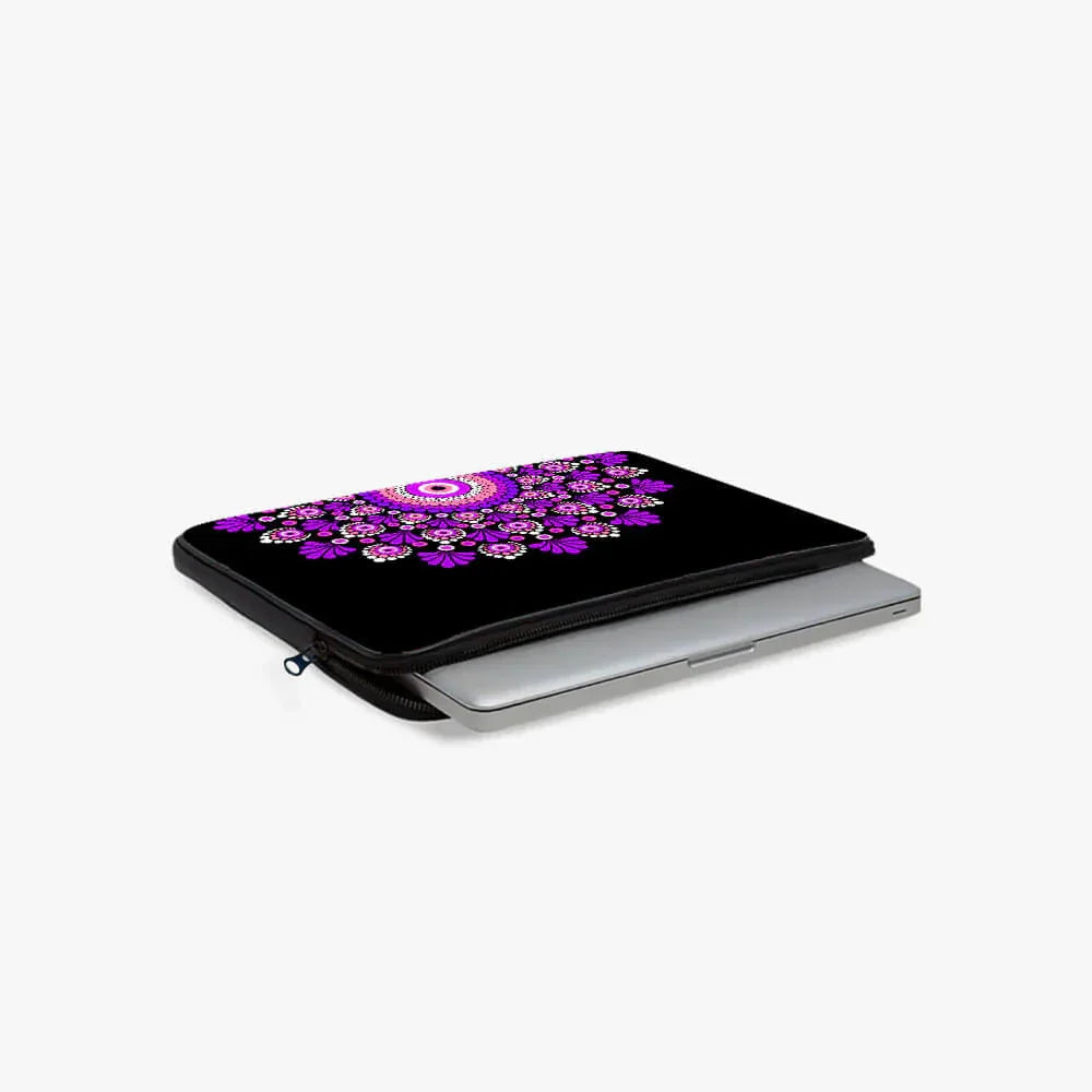 Black laptop sleeve with purple mandala design, partially open with laptop inside