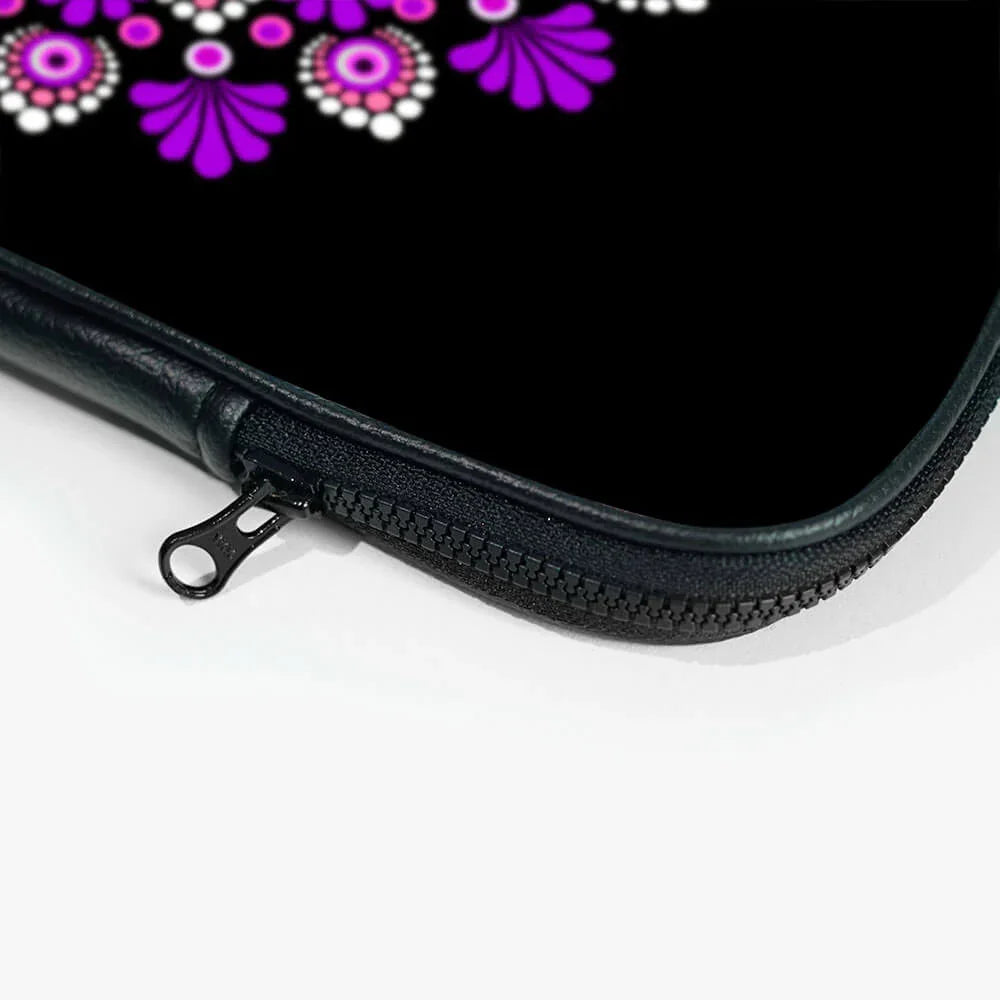 Close-up of black laptop sleeve zipper with purple and pink mandala design