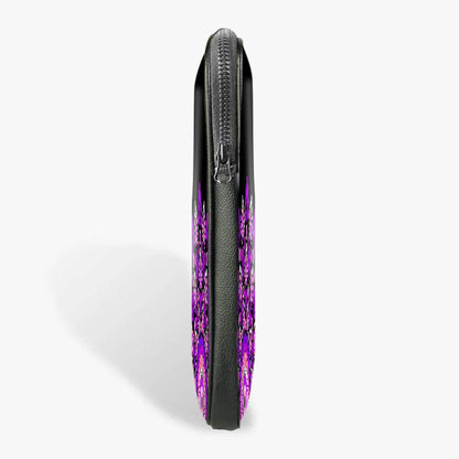 Slim black laptop sleeve with zipper, featuring a purple abstract pattern, side view
