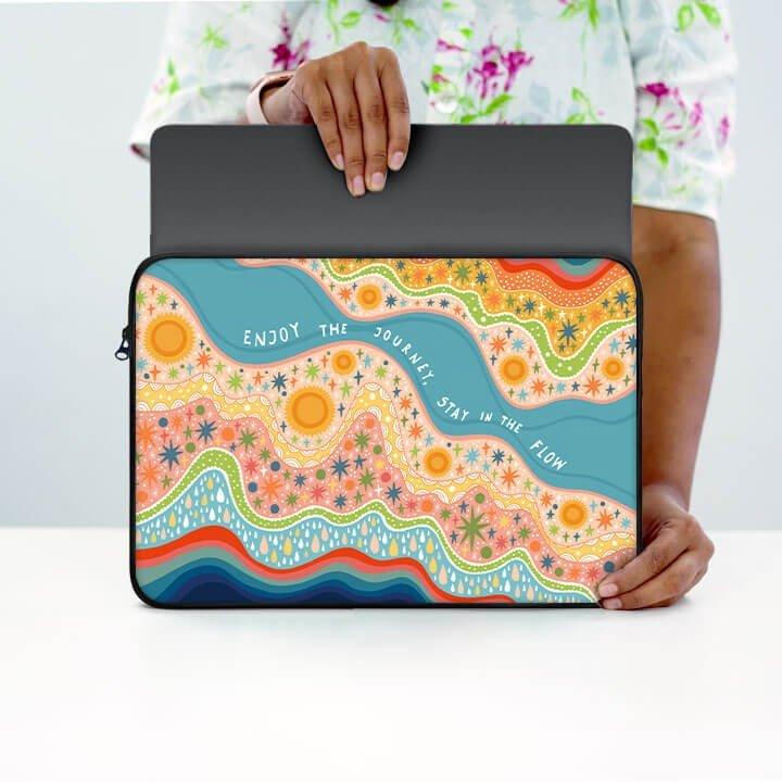 Colorful 13 inch laptop sleeve with abstract floral design and inspirational text.