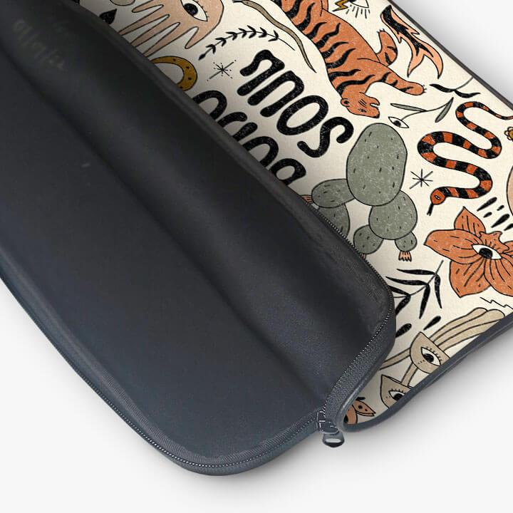 13-inch laptop sleeve with zip pouch, featuring colorful tiger, snake, and floral patterns