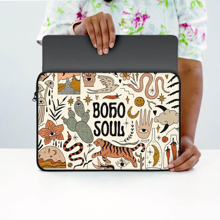 Boho Soul 13-inch laptop sleeve with colorful bohemian doodles, held by a person