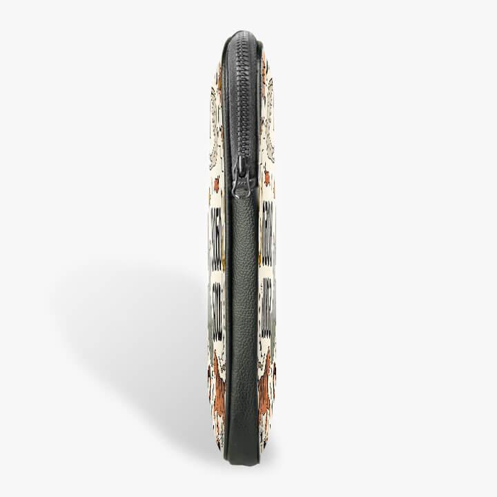 Side view of a 13-inch laptop sleeve with zip closure and printed design
