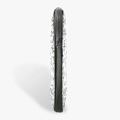 Side view of 13-inch laptop sleeve with zipper closure and black and white pattern