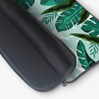 Tropical leaf print 13-inch laptop sleeve with zip pouch, open to show interior
