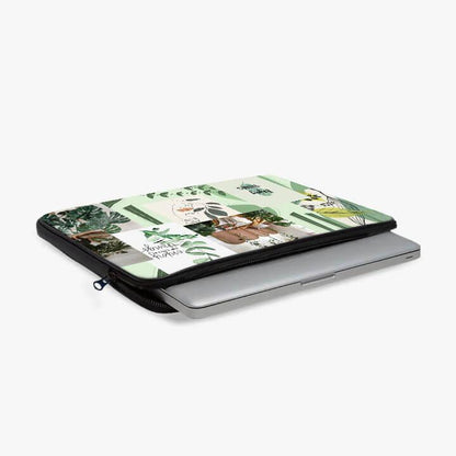 13-inch laptop sleeve with green plant and botanical collage design, partially unzipped