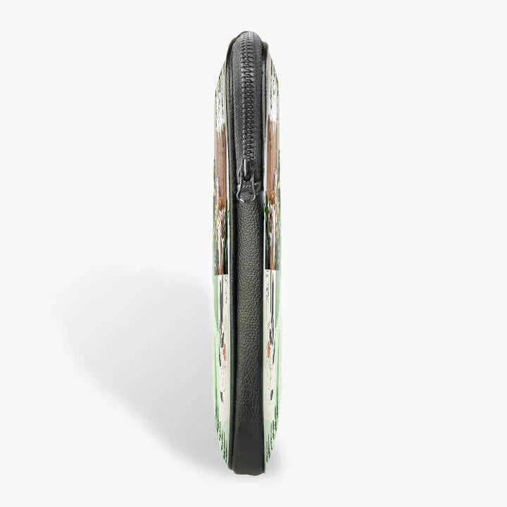 Side view of a slim 13-inch laptop sleeve with zipper and printed design on a white background