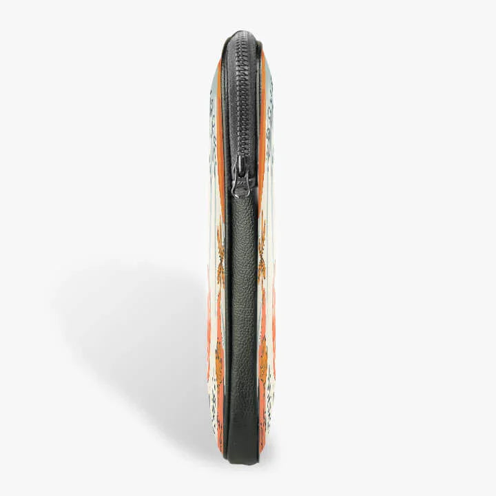 Side view of a 13-inch zippered laptop sleeve with orange and floral pattern