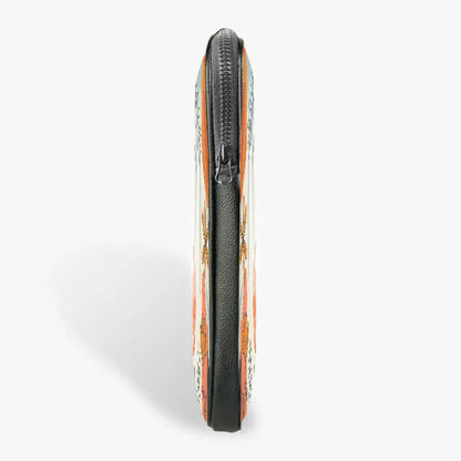 Side view of a 13-inch zippered laptop sleeve with orange and floral pattern