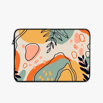 13-inch laptop sleeve with abstract colorful shapes and leaf designs on cream background