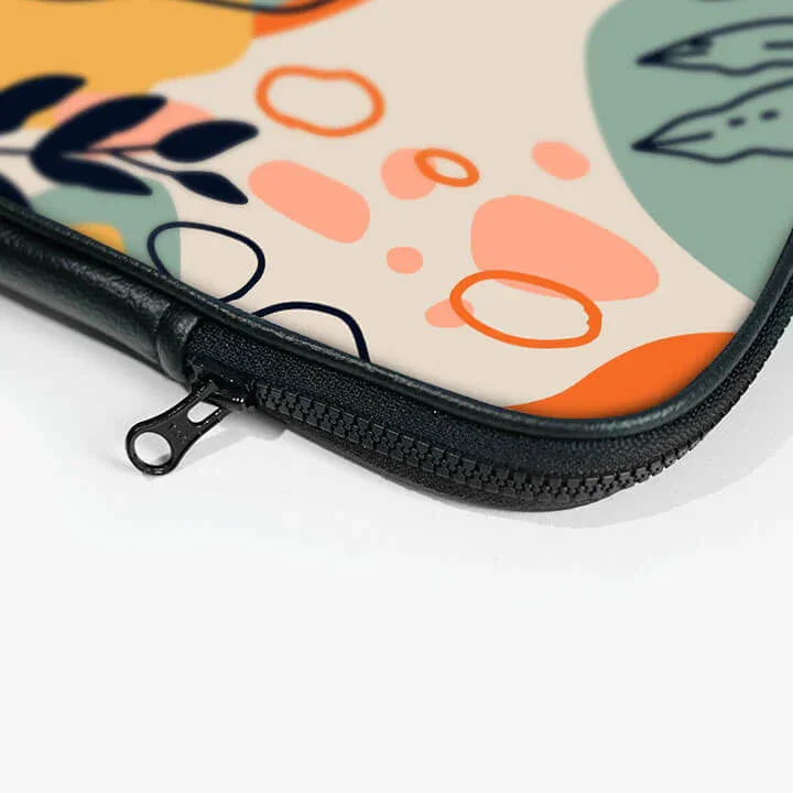 Close-up of colorful laptop sleeve with abstract patterns and black zipper