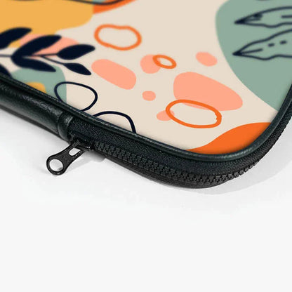 Close-up of colorful laptop sleeve with abstract patterns and black zipper