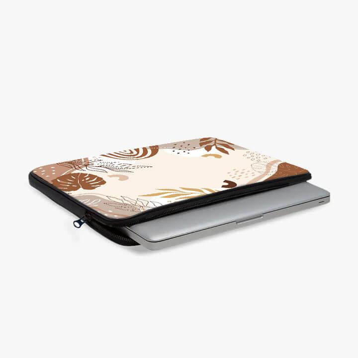 13-inch laptop sleeve with brown and beige abstract leaf pattern, zippered pouch