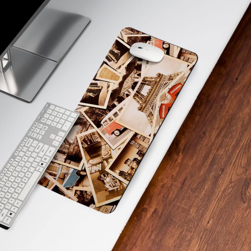 Vintage travel-themed desk mat with city landmarks, mouse, and keyboard on white desk