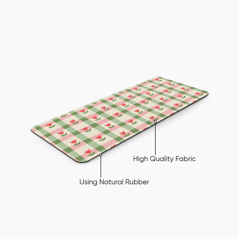 Floral checkered desk mat with pink and green pattern, labeled high quality fabric and natural rubber