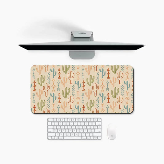 Large desk mat with colorful cactus and geometric patterns, shown with keyboard and monitor