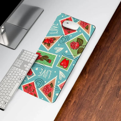 Colorful desk mat with roses, hearts, and love stamp design on a modern workspace