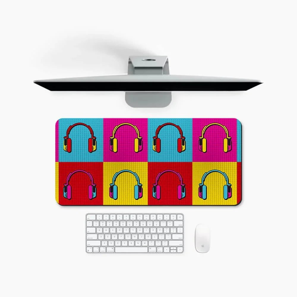 Colorful desk mat with pop art headphones pattern on a modern computer setup
