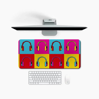 Colorful desk mat with pop art headphones pattern on a modern computer setup