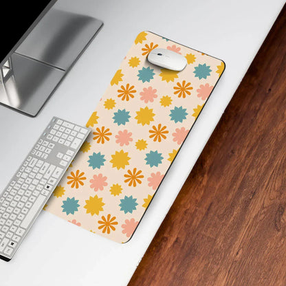 Floral patterned desk mat with computer mouse and keyboard on white office desk