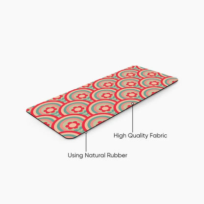 Colorful desk mat with red and green retro flower pattern, labeled natural rubber and fabric